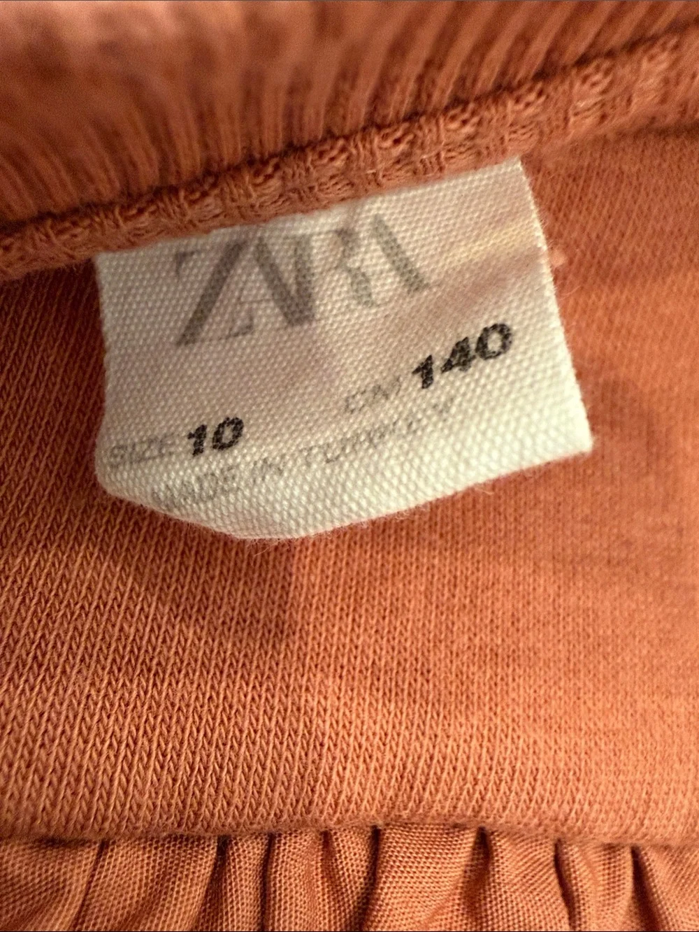 Zara Ruffle Shoulder Sweatshirt in Rust Orange